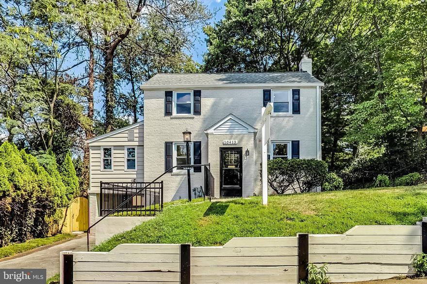 Introducing a picture-perfect, 5-bedroom, 3-full bath turnkey Colonial situated on a generous, level lot that offers a blend of classic elegance and modern upgrades. This bright and airy home unfolds with spaces designed for gathering and entertaining, featuring formal living and dining areas, while the sun-room is the perfect space to retreat for leisurely afternoons (or to work from home). Experience the luxury of a main level owners/guest suite, complete with full bath that promises the perfect sanctuary for relaxation. The heart of the home, a meticulously renovated eat-in kitchen is a chef's dream, fitted with modern amenities and designed for both function and gathering. Ascend to the upper level and find three spacious bedrooms sharing a beautifully renovated bath. The walk-out lower level offers a versatile living space, featuring a fifth bedroom, a third full bath, a walk-in closet, plus a den and laundry room. The home is graced with freshly refinished solid oak flooring on the main and upper levels, and durable Luxury Vinyl Plank flooring in the sun-room and lower level. The bathrooms are renovated to perfection with exquisite tile work and stylish vanities that exude sophistication. Modern lighting fixtures throughout the home provide an airy brightness, enhancing each room's unique charm. Venture outdoors to a fully fenced yard encompassing an expansive, level lot with ample room for gardening, recreation, or future expansion. With a driveway and attached carport, this home offers everything you need to live comfortably. Additional upgrades include new windows, water heater, roof, and electrical with heavy up, making this home as practical as it is beautiful. With nearby parks, shopping, and dining options, and just over a mile to the Wheaton and Forest Glen metro stations, your commute and leisure activities are set to be a breeze. Easy access to the beltway makes weekend getaways or trips to the city incredibly convenient. Don't miss the opportunity to call this stunning property your new home!