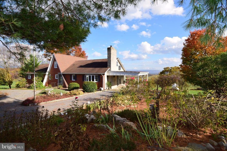 Intake the views from this custom home situated on 3.70 acres. This 1780sqft home offers a large rear deck, carport, walk up attic with craft room, office, den, living room, separate dining room, eat-in kitchen, unfinished basement, work shed, and beautiful views!