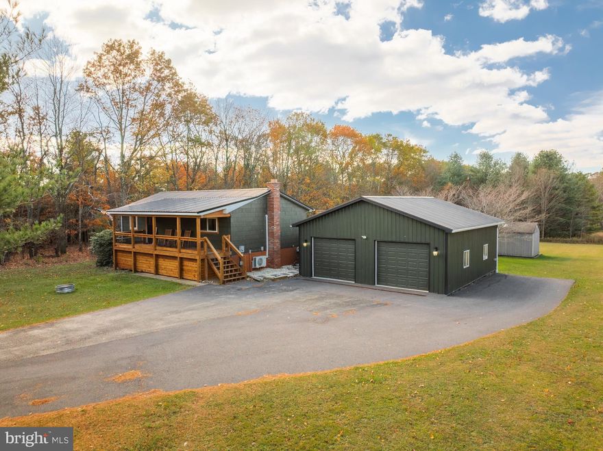 If you are looking for a charming, well-kept home on over 1 level-acre in the heart of McHenry, this is it. The “House of Plaid” was renovated in the summer of 2023 – renovations include all new LVF, wood ceiling in the upper level, new windows, new sliding door, covered front deck, new rear deck, bathroom renovation on main level, new kitchen sink, countertops, and appliances. Each level has two bedrooms and a full bathroom, and both floors also have a cozy living space with plenty of gaming options. The open kit/din/liv area features an electric fireplace and a slider to the rear deck. The exterior space is just as pleasing with two rear decks, a hot tub, fire pit, a spacious yard, and even a 50-amp RV hookup. Enjoy evenings on the deck while viewing incredible Garrett County sunsets! You are within minutes to Deep Creek Lake, Wisp Ski Resort and shopping. Call today to preview this home, it won't last long!