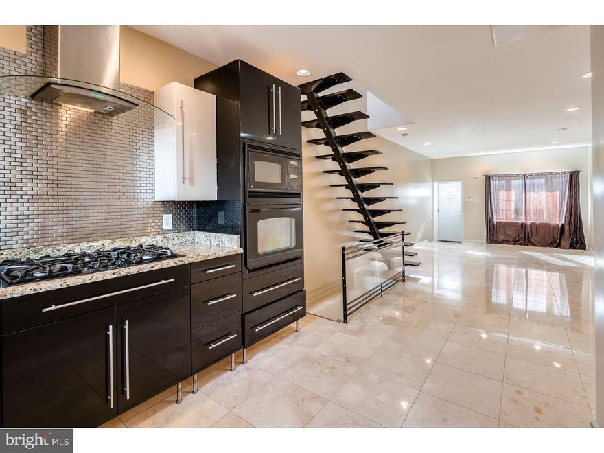 Spectacular home priced well!! Gorgeous kitchen with Granite counters, luxury appliance package including professional vent hood, and tiled backsplash. Tiled bath with with jacuzzi tub, and designed fixtures. Hardwood floor in the bedrooms, designer staircase, security camera and hi-hat lights throughout. The huge walk in closet can be a 3rd bedroom and the partially finished basement is a ton of bonus space! Beautiful brick facade, large rear yard, great space with luxury finishes at a great price! Walk to the waterfront and all that Pennsport/Whitman has to offer!