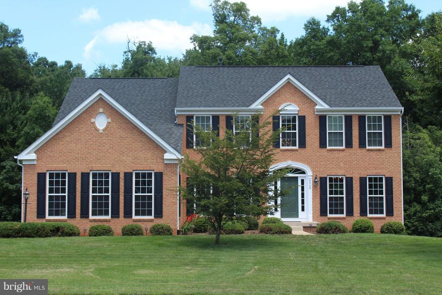 Beautiful Colonial on .72 AC in Brookside. Features - 4BR, 3.5 BA's. 2-story Foyer w/ gorgeous staircase, home office w/ french doors, Kit open to Sun rm and family rm, Deck off sun rm. The upstairs boasts luxury Owner's Suite featuring sitting room, 2 large walk-in closets, corner soaking tub, separate shower and dual vanities. Partial fin Walkout bsmt w/ Rec, Media & Exercise rooms & full bath.