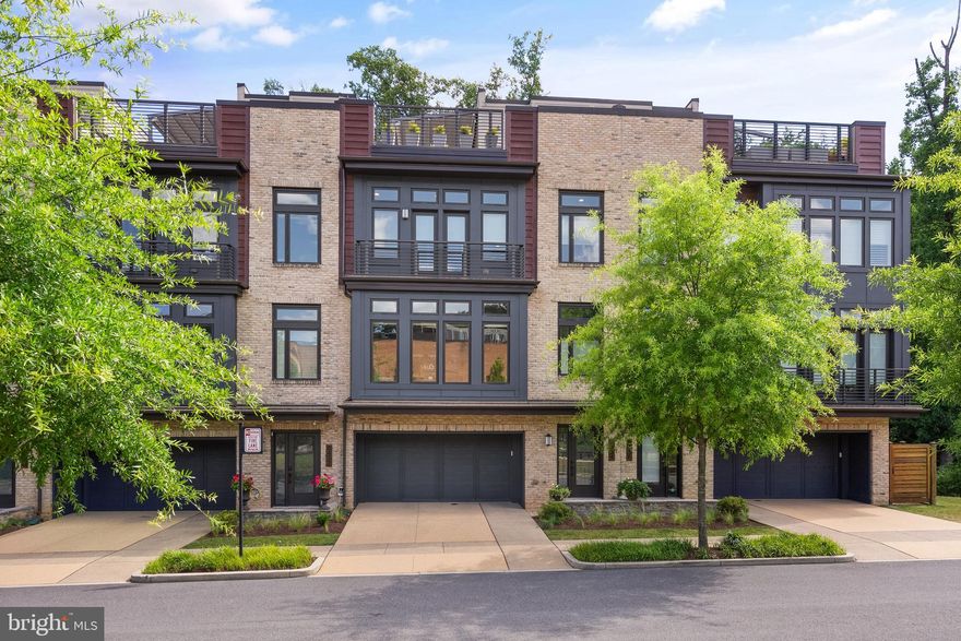 Prepare to be captivated by this stunning LEED Certified 4-bedroom, 3.5-bathroom townhome located in the sought after Grosvenor Heights subdivision. Spanning an impressive total of 4,489 square feet (3102 sq. ft. interior), this meticulously maintained property offers the perfect blend of modern luxury and unparalleled convenience. As you step inside, you'll be greeted by an airy layout with soaring 10-foot ceilings and recessed lighting that creates a warm, inviting ambience. The first-floor flex room/bedroom, with a private full bathroom, provides endless possibilities – transform it into a peaceful home office with views of the manicured zen garden in a private fenced back yard, a cozy guest suite, exercise room, or an additional living and entertaining space. The open kitchen boasts two Thermador ovens, Wolf SubZero refrigerator with custom cabinet-matched paneling, Bosch dishwasher, a vast center island with ample seating and counter space, and a separate counter/bar space. The dining area is surrounded by large windows and natural light, and the living room features a gas fireplace, and access to the private rear deck with a retractable awning, overlooking the serene scenery. Move up to the upper levels and discover the primary suite with custom designed dual closet, and spa inspired primary bathroom. Additionally, this floor offers hardwood flooring, two sunlit secondary bedrooms, full bathroom with upgraded soaker tub, and a conveniently located laundry room. But the wow factor of this property is the expansive rooftop deck, outfitted with a Corradi retractable roof pergola and an outdoor kitchen complete with a Viking mini fridge, wet bar, and gas hookup. Brazilian hardwood deck tiles complement the rooftop, creating an ideal space for outdoor living and entertaining. With an elevator for added convenience, and a 2-car garage with storage capacity, this home is designed to simplify your daily life, with easy low maintenance. Other features include Cat6 wiring in the living room with multiple ethernet direct wiring outlets, marble-look ceramic tile flooring in the lower level, custom stair rails throughout, whole house water filter, and Porcelanosa wood-look porcelain tile on three floors. Located within the prestigious Grosvenor Heights community, this luxury townhome offers the perfect balance of privacy and accessibility. Stroll through the lush green walking paths of Fleming Park, Bethesda Trolley Trail, and Rock Creek Trail, and conveniently access the red line Metro, major highways, Wildwood shopping center, Pike and Rose, Music Center at Strathmore, and more. Don't miss your chance to make this exceptional townhome your new sanctuary. Schedule a private tour today!