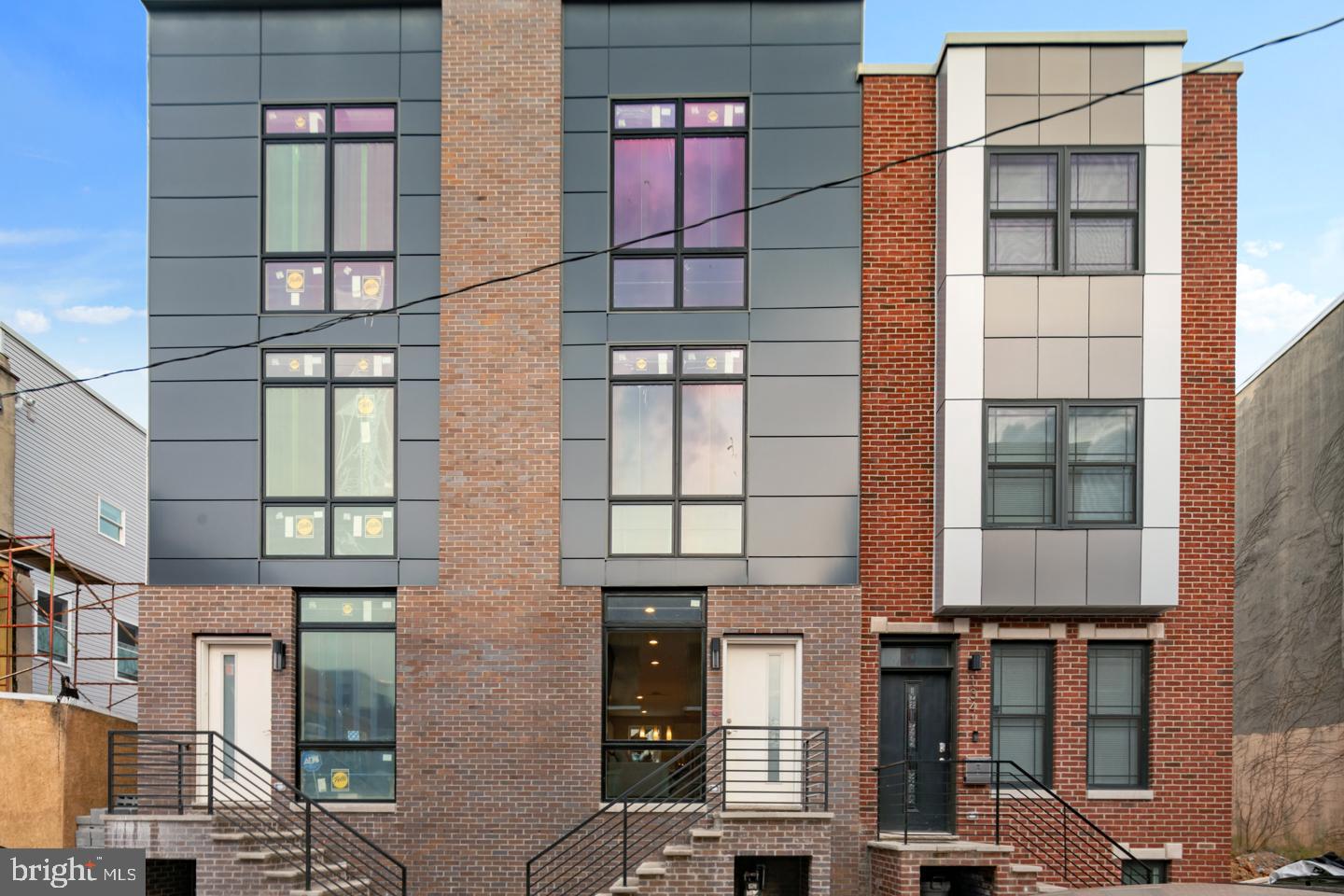 10 YEAR COMMENCEMENT TO TAX ABATEMENT APPROVED. Gorgeous new construction 3 bed 3 bath townhome by Resnick Development in booming Brewerytown. Upon entering the home, the bright living room welcomes you with oak hardwood floors and floor-to-ceiling windows to maximize natural lighting. Enter the designer kitchen complete with stainless steel appliances, Calcutta quartz counter tops, baroque glass tile blacksplash, and a built-in island with entry to a private, fenced in rear deck. Head downstairs to a fully finished basement with powder room. Walk upstairs and notice the bright bedrooms with ample closet space and windows. Upstairs is the master's bedroom with floor-to-ceiling windows, a designer bathroom which boasts calcatta polished floors, modern double floating vanity, and glass shower with porcelain marble tile shower floor and rainfall shower head along with a custom wetbar in the hallway. Enjoy Philadelphia's skyline on the beautiful roof deck. For security and comfortability, the home is upgraded with Vivint integrated smart thermostat and security system. 10 year tax abatement included and is in walking distance to Aldi, Crime & Punishment, Pizza Dads, RyBrew, 2637 Brew, Fit Academy, Green Eggs upcoming with easy access to the Art Museum and 76!
