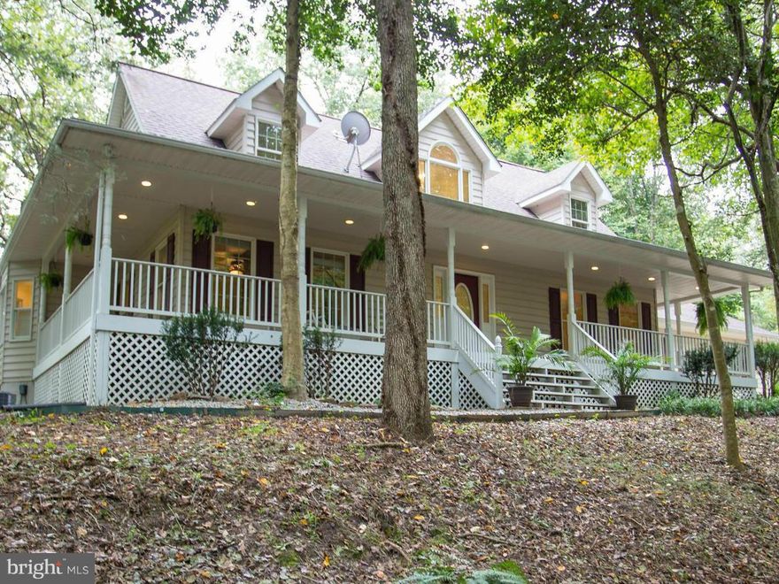 Amazing Views Custom Built & Completely Remodeled Cape Cod on 3 Gorgeous Wooded Acres Overlooking Historic Dam on The Po River. Beautiful View & Water Frontage the Home Boast Open Floor Plan W/Cathedral Ceiling, Wood Floors, New Granite Countertops, New Ceramic Floors, New Roof, New Appliances, Sun Rm, Oversized Garage, New 2 Zoned HVAC System. First Fl Master W/ Walk-In Closet. Wraparound Porch!