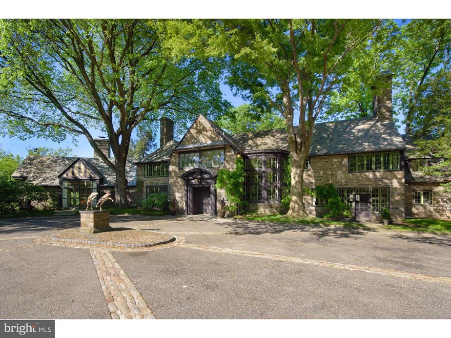 Legend has it that "River House" was built for Leopold Stokowski, director of the Philadelphia Orchestra, and his lover,  famed film star, Greta Garbo, but following a disagreement, they never acquired the home. Instead, River House was purchased by Helen Tyson Madeira and Louis C. Madeira IV in 1940, and the Madeira family lived there for nearly three-quarters of a century. As one of the original Monk Road families, the Madeiras were able to choose their own address, and they chose 1600, after the address of the White House.  Offered to the market for the first time since their initial purchase, this magnificent 7+ bedroom 7 full bath home offers exquisite detailing in both its formal and family spaces. Spectacular step down Living Room with plaster moldings, pickled trusses and exposed beams is bathed in natural light by floor to ceiling windows and French doors.  Handsome library is highlighted by hand crafted American cherry paneling and a hide away wet bar. Enjoying an eastern exposure to a wide bluestone terrace, the library welcomes morning light and long views of the property's varied topography and specimen plantings. Following a wide stone hall, find an oval shaped formal dining room, with hand pegged wood floors, two exposures of light and deep storage closets, one out fitted for silver storage and the other for hanging linens.  This dining room is as elegant today as when it hosted notable guests throughout the homes history.  Second level provides a deluxe master suite with his and her baths and dressing rooms, three additional family or guest rooms each with en-suite baths and three additional bedrooms or sitting rooms located off the back stairs with two full baths. An exit to the outside, steps away from the four+ car garage makes this space ideal for independent living quarters.  Enveloped by 25 acres of conserved pastoral, groomed and naturally landscaped grounds which connect to the bridle wild trails, the homes is a study in gracious country mansion style architecture.