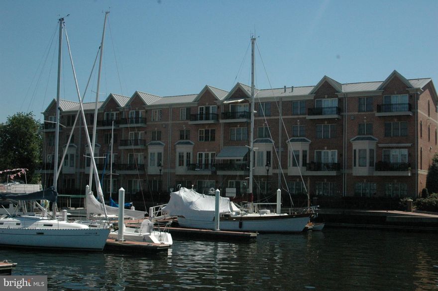 Terrific recently built waterfront townhome in the desirable community of "The Moorings."  The breathtaking views from all levels, walk out to promenade, & nearby marina & tiki bar offer a resort like relaxing feel.  The ELEVATOR offers convenience & ease in navigating 4 floors, including expansive 4 th floor master suite.  Freshly painted, new carpet, wood floors - ready for immediate occupancy.