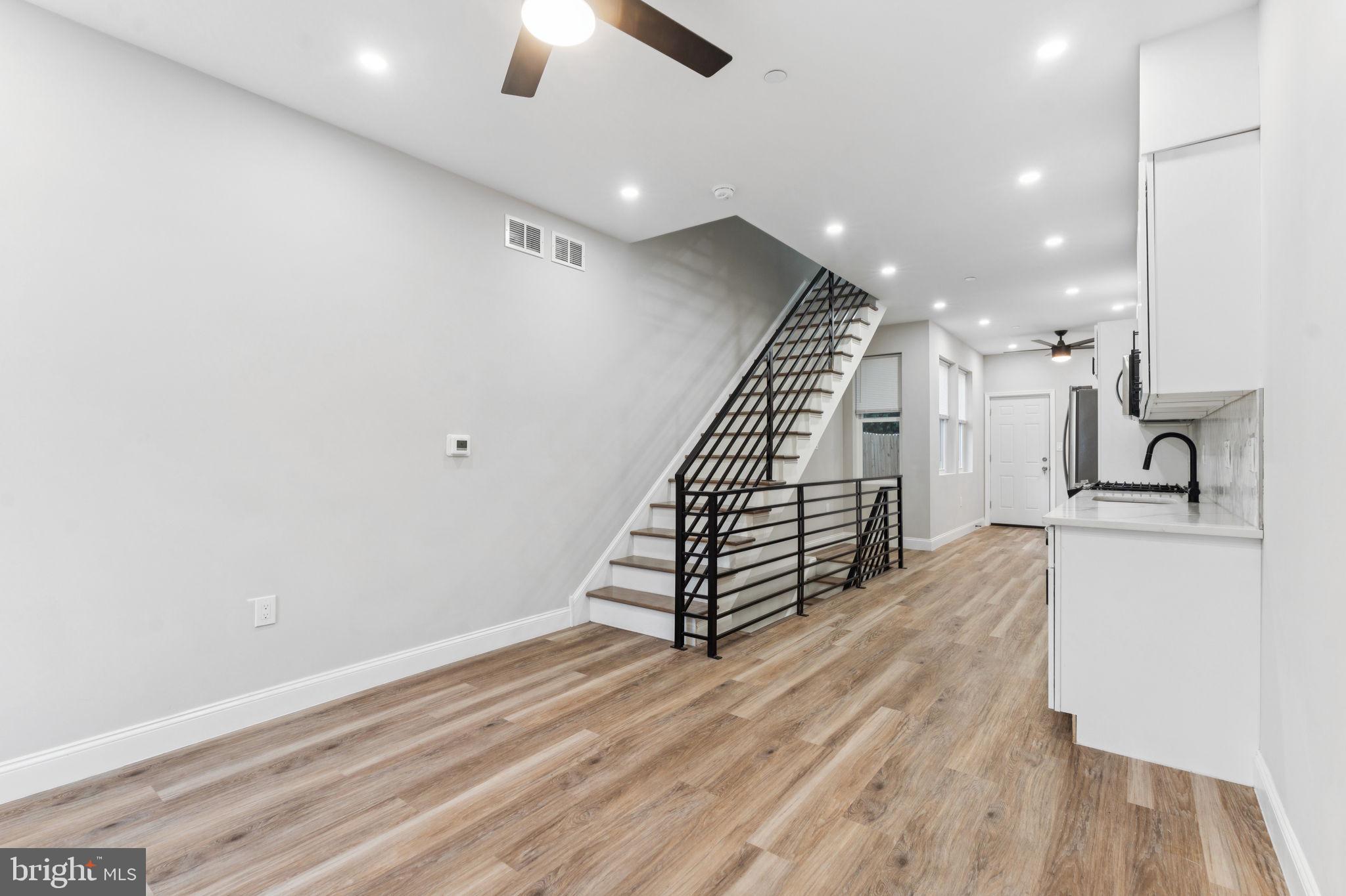 Welcome to 2006 N Bodine St, a brand-new construction 3-bedroom, 3-bathroom home in the heart of Olde Kensington. This modern residence features spacious interiors, high-quality finishes, and a private rooftop deck with stunning city views. Enjoy a fully finished basement with a full bathroom and egress window—ideal for a guest suite, home office, or extra living space. The tall fenced-in yard offers privacy and room to relax or entertain. Situated in a vibrant neighborhood, you'll be just minutes from popular spots like Laser Wolf, Front Street Café, and Human Robot Brewery, as well as nearby parks like Liberty Lands and Hancock Playground. With easy access to Fishtown and Northern Liberties’ top dining, shopping, and entertainment, this home offers the best of city living. Don’t miss this opportunity—schedule your showing today!