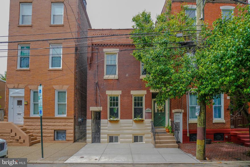 Old world charm combined with modern amenities!!! Truly a one-of-a-kind unique home.

Welcome to 1128 Marlborough Street located on one of the most desired blocks in Riverside, Fishtown. New front cement walkway. Classic front brick façade, original beautiful front wood door . Foyer with original ornate tiled floor and walls. The double interior doors lead to formal living room with decorative fireplace and chandelier, and original hardwood floors.  10 ft ceilings t/o.

Hall leading to a large formal dining room with two large cedar closets,  chandelier, and hardwood flooring . Modern kitchen with marble flooring, stainless steel refrigerator, stainless steel gas range, granite countertops, island with wine rack and seating. Maple cabinets, stainless steel double sink, pendant lighting, recessed lighting, built in microwave, stainless steel dishwasher.

The kitchen opens to a bonus sunroom with powder room, 2 skylights, wall mount gas heater, engineered wood flooring, recessed lights, and ceiling fan.

 Sliders leading out to a large private fenced maintenance free brick yard with surrounding flower beds and beautiful plants and shrubbery, a perfect backyard oasis for relaxing or those summer bbqs.

Nice full unfinished basement perfect for the new owners to finish for that extra living space or storage!  

Up the original staircase with decorative wood banister, the 2nd floor features a large rear bedroom with ceiling fan, bay window style bump out and hardwood floors and closet. 2nd bedroom with hardwoods, and closet. Hall bath with original clawfoot tub/shower, updated ceramic tile floor, original black and white walls tile, and original built-in wall medicine cabinet.

Modern primary bathroom with ceramic tiled heated flooring, double sink with granite top, large stall shower with glass doors and tiled walls. Large primary bedroom features a ceiling fan, hardwood flooring, recessed lights, and a walk-in-closet with stacked washer/dryer!!! Upstairs rooms feature original transom windows above original wood doors. Large long side trash alley for additional storage . 

100 amp breaker box, radiator heat, new gas hot water heater and mini splits t/o for energy  efficient air conditioning! Newer vinyl windows throughout and newer whole house main drain. Located near all the top restaurants, breweries, and bars Fishtown has to offer! Walk to Penn Treaty Park, The Fillmore, public transportation.  Minutes to Center City and the Ben Franklin Bridge.

OPEN HOUSE SUNDAY MAY 15TH, 1-3 PM