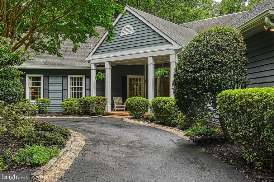 This beautiful and unique home sits on the perfect point lot with mile+ long views on the private side of LKA. Featuring 500+ ft of bulkheaded shoreline, a meandering walk-way to the water, a gazebo, and a two slip enclosed boathouse with electric lifts, a large storage area, a freshwater shower, a large covered deck area and multiple sunning areas. The yard has a very gentle slope making it ideal for multiple generations of family and friends to gather by the water.  The unique home was well thought out and sits perfectly to optimize sensational views from nearly every room; beginning when you walk into the foyer and into the vaulted & beamed family room, where you are surrounded by windows/doors offering light and massive lake views and extending into the open dining room and kitchen. The kitchen boast a b'fast area, lots of cabinets space, granite counters, and island with cook top, double wall ovens and views.  A total of 5 bedroom (4 bedroom septic),  4.5 baths and two living areas offer the space you need for entertaining family and friends. The owners suite and laundry are all on the main floor. Other notable features are hardwood floors, new carpeting, some new paint, built in shelves, a fireplace,  a deck that runs the full length of the rear side of the property, a paved driveway and the gorgeous mature landscaping and hardwoods. Some furnishing convey.