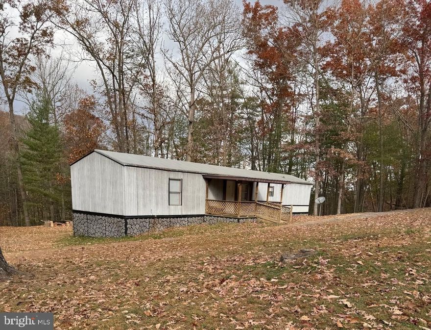 Level lot 2 +/- acres, unrestricted with a new survey.  Conveniently located near to Moorefield for shopping, schools and health facilities.  Three bedrooms and 2 bath recently upgraded manufactured home.  New flooring/carpet & laminate.   Beautiful location.  Call to schedule a showing.