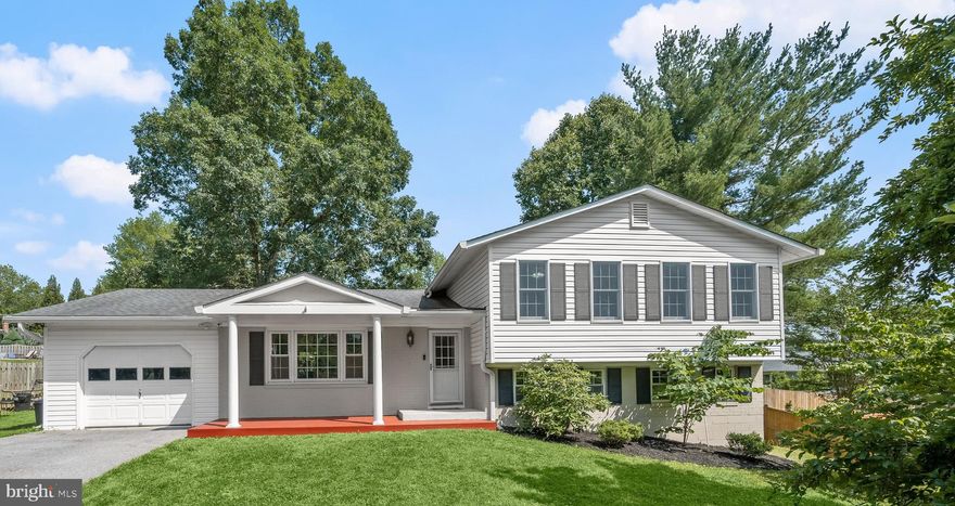 Set on a private cul-de-sac street - this spacious 4-level Single Family Home offers 2600+ square feet of finished living space on 3 levels. There is an additional 4th level (basement) that is currently used for storage/utilities but could easily be finished as additional living space. The entire home is freshly painted with a neutral palette. The main level of this home features hardwoods throughout, a dining room with slider access to the rear patio & fenced yard, a living room with plenty of wall space for couches and a tv, and a kitchen with upgraded cabinetry / stainless steel appliances/ granite countertops / tiled backsplash/ breakfast bar/ and space for a table. There is access to the garage through the kitchen which makes unloading groceries in a breeze. The upper level has all new carpeting throughout. The primary bedroom has crown molding, a ceiling fan, a walk-in closet, and plenty of wall space for a bed and dresser/armoire. An attached en-suite full bath features an upgraded vanity with countertop space, toilet, & an upgraded tiled shower. The upper level secondary bedrooms have crown molding and access to an upgraded second full bath with tub/shower. The finished lower level (only 5 steps down to get there!) has all new carpet and offers a family room with windows, overhead lighting, and a wood-burning fireplace. Additionally, there is a natural light-filled office (optional 5th bedroom), a half bath, and a laundry room / mudroom with access to the side yard. The expanded driveway offers space for a turn-around and parking for 6 additional cars.  Just minutes away from Starbucks, Grocery Stores, and Damascus Community Recreation Center. Updates/Special features include: HVAC - 2018, Roof - 2014, a covered porch w/ decking, some updated windows, upgraded light fixtures, and window shades/blinds throughout.