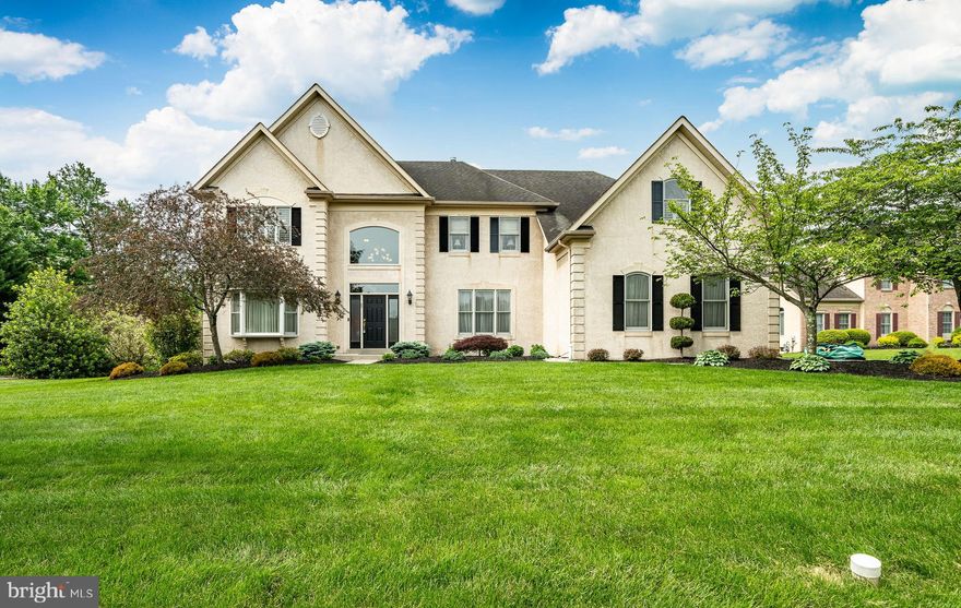 Welcome to this stunning Colonial home situated in the heart of Montgomery Township, conveniently located near major routes and shopping centers. As you step inside, you are greeted by an impressive two-story marble foyer featuring a breathtaking staircase that sets the tone for the elegance found throughout the home. Flanking the entrance are the formal living room and dining room, both adorned with beautiful hardwood floors and custom woodwork, perfect for entertaining guests.At the rear of the house, you’ll find a spacious two-story family room illuminated by recessed lighting, complete with a cozy fireplace and palladium windows that offer a picturesque view of the backyard—ideal for hosting holiday festivities. The family room seamlessly flows into a massive eat-in kitchen, which provides ample seating for ten at the dining table. The center island offers additional prep space on luxurious granite countertops, complemented by 42-inch cabinets that provide maximum storage. A stylish tumbled tile backsplash enhances the kitchen's beauty, while the double wall oven offers ample cooking space for all your entertaining needs. The first floor also features a convenient study off the family room, complete with new hardwood flooring, and a laundry room that leads to a spacious three-bay garage. Ascend the butterfly staircase to the second floor, where the landing overlooks both the foyer and family room, creating an open and airy feel. The primary bedroom is a serene retreat, featuring a double door entry, a tranquil tray ceiling, and custom closets. The ensuite bathroom boasts a luxurious jacuzzi tub, a glass shower door, and tasteful tile accents. This level also features three additional bedrooms, two bathrooms, and a Jack-and-Jill bathroom, providing ample space for both family and guests.