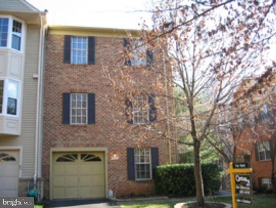Spacious end townhome backs to woods; 2 large master suites each w/full bath & vaulted ceilings; Wood floors in foyer, stairs, dining room; Generously sized LR; Kitchen w/granite counters & breakfast bar; Table space in kitchen; LL rec room w/FP, 1/2 bath & SGD to deck & fenced rear yard. New windows. Fresh paint/new carpets. Sought after West Springfield Pyramid.  OUTRAGEOUS New LOW LOW Price!