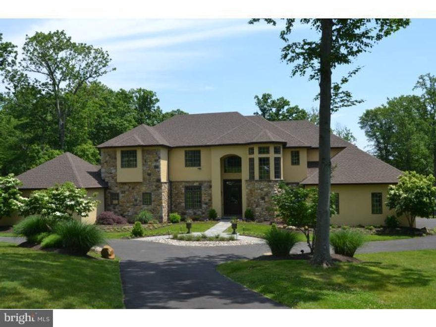 Located in the heart of one of Upper Makefield's most coveted communities and locations sits this spectacular custom built home on 5 + acres. Featuring all of the requisite amenities excepted in an estate property, the home is traditional yet sophisticated and stylish with an expansive wide open floor plan. Magnificent kitchen / entertainment area with top of the line stainless appliances, granite counters, two story family room with wall of windows and floor to ceiling fireplace. A second intimate sitting area also has fireplace. The upper level features hardwood throughout, master bedroom with entry sitting area. A large princess suite with 3 additional bedrooms offer many options. The lower level may be the nicest currently on the market. Second kitchen, full service bar, wine cellar, gym, entertainment area, full bath and more. To top it all off, the fantastic outdoor space includes kitchen, fireplace, gardens, and perfectly sited in-ground pool. If ever a home was designed for entertaining, this is it.