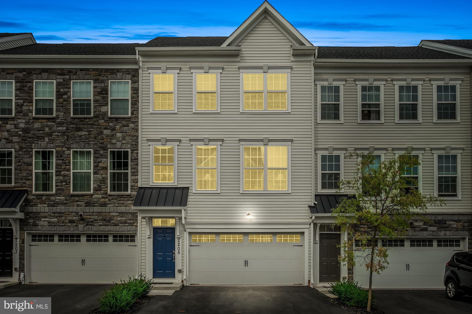 Motivated seller wants to find a new Owner for their lovely home. Welcome to this gorgeous one year young move in ready townhouse located in the convenient neighborhood of High Grove. This attractive community features easy living at its best, conveniently located off Route 611 and the Valley Square Shopping Center which offers over 35 stores, trendy restaurants, Wegmans, and much more. This spacious and stylish townhouse is tucked back in the neighborhood and features numerous upgrades throughout and features a bright open floor plan, perfect for today's stylish buyers. The home features a three story concept, with lower level two car attached garage and a huge finished walkout great room with bright windows and a sliding door leading out to the patio. There is also a full bathroom and storage area. Once you walk in the front door you are greeted with features such as hardwood staircase leading up to the first level the entire first floor in an upgraded hardwood floor running seamlessly throughout. Relax and have a glass of wine in the formal living room which is overlooking the foyer, and adjacent is a spacious dining room, perfect for large family gatherings. The upgraded and customized kitchen features a soft grey painted 42 inch cabinetry and high end granite counters, all stainless steel appliances, with a gas range, and a huge center island which offers plenty of space for the cooks in your family and perfect for hosting all your dinner parties and a sliding door which leads out to the second level deck which overlooks dedicated and preserved wooded area and a community tot lot. Adjacent to the kitchen is a morning room, perfect for a quiet sitting and t.v area and also off the kitchen area is a bright sunbathed sunroom which offers many uses such as a cozy breakfast area, or an additional place to relax and read a book, or your baby grand piano. Upstairs you will enjoy and relax in your spacious owners suite with sitting room, vaulted ceiling, two walk in closets, and a well appointed master bathroom featuring upgraded tile throughout, a relaxing Koehler soaking tub, spacious double vanity, and walk in shower. The secondary bedrooms all have spacious closet and share the hall bathroom with well appointments in tile and upgraded vanity and lighting. Laundry is conveniently located on the second floor. Other fine features of this home include 9 foot ceilings on the first and second floor, an abundance of recessed lighting throughout, brushed nickel door handles, Moen faucets, and a professionally painted interior. Bring your buyers they will be impressed by the quality and pride of ownership, its new construction without the wait.