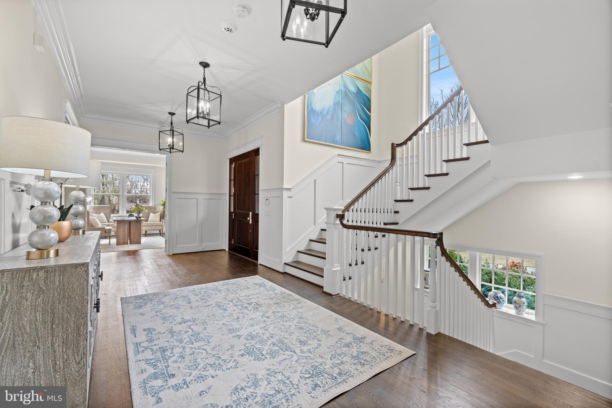 Outstanding Solid, Masterfully Built with high ceilings throughout and 2 staircases - Welcome to 6616 Lybrook Court, an extraordinary quality residence built by premier custom home builder Sandy Spring Builders and designed by GTM Architects. Nestled in the exclusive and highly desirable Burning Tree neighborhood, this meticulously maintained home sits on a beautifully landscaped nearly half-acre lot (0.42 acres) and offers over 7,800 square feet of luxurious living space across three finished levels. Flooded with natural light, every space in this home feels bright and inviting.
Built in 2012, this stunning home features five bedrooms, five full baths, and two half baths, along with an oversized side-load three-car garage and a spacious, flat driveway. Thoughtfully designed with custom high-end finishes throughout, it boasts soaring 10’ and 9’ ceilings, elegant moldings, rich hardwood floors, coffered ceilings, energy-efficient Low-E windows, and the convenience of both front and back staircases for seamless flow between levels.
The main level impresses with an inviting foyer featuring a dramatic two-story staircase with expansive windows that flood the space with natural light. To the right, a handsome library with built-ins offers access to the charming covered front porch, while the formal dining room on the opposite side enjoys access to a separate covered porch, creating a seamless indoor-outdoor flow. A guest powder room is conveniently located just off the foyer.
The heart of the home is the gourmet chef’s kitchen, featuring honed granite countertops, an expansive Carrera marble island, and top-of-the-line stainless steel appliances, including a Sub-Zero refrigerator, a Wolf gas range, Wolf double wall ovens, and a Bosch dishwasher. A large pantry provides plentiful storage, while a butler’s pantry with custom cabinetry and a beverage refrigerator connects the kitchen to the dining room for effortless entertaining. The kitchen seamlessly opens to a sunlit breakfast room and a spacious family room, complete with an impressive, coffered ceiling, built-ins, a gas fireplace, and access to the rear slate terrace.
An oversized, well-appointed mudroom serves as a functional hub of the home, offering abundant storage, custom-built cubbies, large closets, and direct access from both the side-entry covered porch and the three- car garage garage. This space also includes one of the two main-level powder rooms, ensuring convenience for everyday living.
Upstairs, the luxurious primary suite boasts two generous walk-in closets with custom built-ins, a spa-like bath with heated floors, a free-standing soaking tub, a shower room, dual vanities, and a private toilet closet. Three additional bedrooms, each with en-suite baths, provide exceptional comfort. A versatile bonus sitting room with built-in workspaces and a spacious laundry room with ample counter space and cabinetry complete this level.
The walkout lower level is an entertainer’s dream, featuring almost 10 foot ceilings, a large recreation room with a gas fireplace, a bedroom with a walk-in closet and full bath, an exercise/media room, and three additional storage rooms. Brand-new carpeting enhances the space, and front and back staircases ensure easy access to all levels.
The large lot actually extends well beyond the privacy trees. Please see site plan. You could easily expand the backyard to create more usable space or add a new privacy fence farther back behind the privacy trees, especially if you are considering a pool or other outdoor features.
Set in an exclusive neighborhood known for its stunning architecture and peaceful surroundings, this home is beautifully landscaped with lush greenery and a spacious, flat driveway. Enjoy the convenience of easy access to downtown Bethesda and major commuting routes while cherishing the charm and privacy of this extraordinary property. A rare opportunity—don’t miss it!