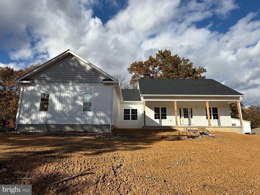 New Construction on 2 Acres – Ready end of November!

Lot 134A Catlett Mountain Road, Front Royal, VA 22630

Welcome to your dream home in the Blue Ridge foothills! This custom-built one level home sits on 2 private acres with no HOA, just minutes from the Shenandoah River, historic Downtown Front Royal, local restaurants, wineries, golf, hiking, and I-66 for easy commuting.

Property Highlights

1900 sq. ft. above grade finished living space

1900 sq. ft. unfinished walk-out basement with:

Full finished bathroom

Rough-in for additional bath

Oversized 2-car garage (21.7 x 22.10) with insulated walls & doors

Paved driveway & 4' concrete walkway, $1500 landscaping package, concrete front porch, with 6' sealed steps.  Porch has recessed lighting, black metal railing, cedar posts & two ceiling fans installed. 

Interior Features

9 ft. ceilings on main level, cathedral ceilings in family room

Gas fireplace with slate mantel & hearth

Luxury Vinyl Plank floors throughout, tile in all bathrooms

Ceiling fans in family room & bedrooms

Main-level laundry

🍴 Gourmet Kitchen

36” & 42” white solid wood cabinets (dovetail, soft-close)

Granite countertops with subway tile backsplash

Large center island with bar seating & breakfast nook

Upgraded stainless steel appliances

Owner’s Suite Retreat

Spacious walk-in closet

Luxury bath with:

60” free-standing soaking tub

5’ tiled shower

60” double vanity with middle sitting area

 Construction & Utilities

Board & Batten Siding on the front of house and shaker siding above the garage windows.

30-year architectural shingles

Double-hung windows with wrapped PVC

Upgraded thermal doors

50-gallon hot water heater

Train Heat Pump 

High producing well, 20 gallons a minute 

High-speed internet available – perfect for remote work

 Location Advantage: Just minutes to the Shenandoah River, Skyline Drive, Appalachian Trail, local wineries, golf courses, and the heart of Front Royal. Easy access to I-66 makes commuting a breeze.