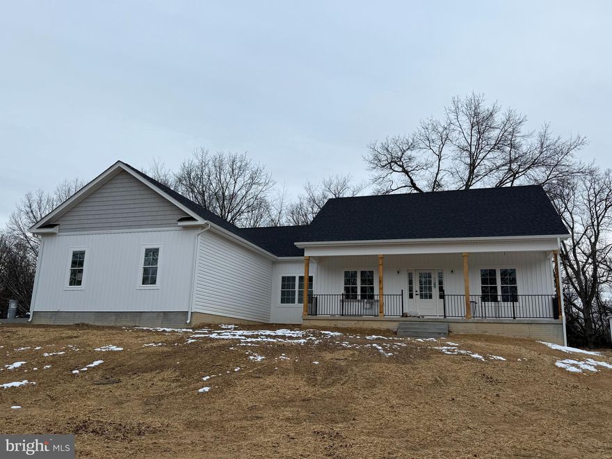 New Construction on 2 Acres – Ready end of November!

Lot 134A Catlett Mountain Road, Front Royal, VA 22630

Welcome to your dream home in the Blue Ridge foothills! This custom-built one level home sits on 2 private acres with no HOA, just minutes from the Shenandoah River, historic Downtown Front Royal, local restaurants, wineries, golf, hiking, and I-66 for easy commuting.

Property Highlights

1900 sq. ft. above grade finished living space

1900 sq. ft. unfinished walk-out basement with:

Full finished bathroom

Rough-in for additional bath

Oversized 2-car garage (21.7 x 22.10) with insulated walls & doors

Paved driveway & 4' concrete walkway, $1500 landscaping package, concrete front porch, with 6' sealed steps.  Porch has recessed lighting, black metal railing, cedar posts & two ceiling fans installed. 

Interior Features

9 ft. ceilings on main level, cathedral ceilings in family room

Gas fireplace with slate mantel & hearth

Luxury Vinyl Plank floors throughout, tile in all bathrooms

Ceiling fans in family room & bedrooms

Main-level laundry

🍴 Gourmet Kitchen

36” & 42” white solid wood cabinets (dovetail, soft-close)

Granite countertops with subway tile backsplash

Large center island with bar seating & breakfast nook

Upgraded stainless steel appliances

Owner’s Suite Retreat

Spacious walk-in closet

Luxury bath with:

60” free-standing soaking tub

5’ tiled shower

60” double vanity with middle sitting area

 Construction & Utilities

Board & Batten Siding on the front of house and shaker siding above the garage windows.

30-year architectural shingles

Double-hung windows with wrapped PVC

Upgraded thermal doors

50-gallon hot water heater

Train Heat Pump 

High producing well, 20 gallons a minute 

High-speed internet available – perfect for remote work

 Location Advantage: Just minutes to the Shenandoah River, Skyline Drive, Appalachian Trail, local wineries, golf courses, and the heart of Front Royal. Easy access to I-66 makes commuting a breeze.