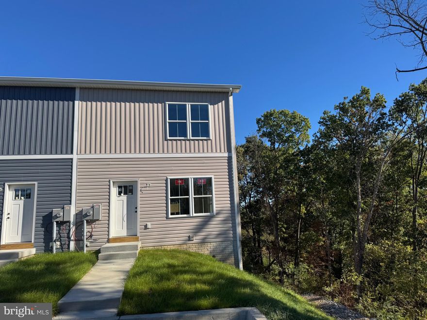 Seller offering up to $10,000 in closing assistance.   Welcome to this beautifully designed 3-bedroom, 2.5-bath duplex offering comfort, space, and modern finishes. The open - concept main level features a stylish kitchen with granite countertops, 3x5 island, 4 piece black/stainless appliances,  and ample cabinetry, perfect for everyday living and entertaining. Upstairs, you’ll find three spacious bedrooms, including a primary suite with a private bath. Enjoy outdoor living on the 12x12 deck, ideal for relaxing or dining al fresco. The full unfinished basement provides endless potential for future expansion or storage.  This home features a 2 zone HVAC system to maximize your comfort.  A perfect blend of function and style—don’t miss this opportunity!!   House can be complete in less than 30 days.   Exterior photos are of the actual house.   Interior photos are of similar construction.