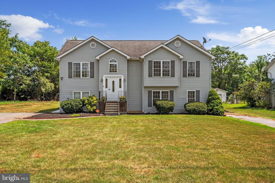 This house is one you must visit if you're searching for a lot of square footage plus a sizable, secluded backyard. Situated on over a half-acre corner lot in the back of the community away from I-81 and next to an unbuildable lot, this home feels extra private and spacious. This property has recently been refreshed with new carpet, new paint, and an updated kitchen with granite counters, a tile backsplash, and a double oven. Along with the eat-in kitchen, the upstairs level has a living room and dining room with vaulted ceilings for a spacious feel, two secondary bedrooms with a full hall bath, plus the primary bedroom boasts an ensuite with dual vanities and a walk-in closet. You can enjoy the secluded backyard that backs up to trees from the composite deck that is located just outside the living room. Downstairs is another bedroom, a recreation room, and a space for another legal bedroom if needed by adding a door, or it can be used as a second recreation room. A full bath, laundry room, and storage closet complete this walkout lower level. This home is move-in ready and is quite accessible to travel to work and school thanks to its proximity to Route 11 and Interstate 81, but at the same time, it feels quiet and near to  nature. Book your showing today!