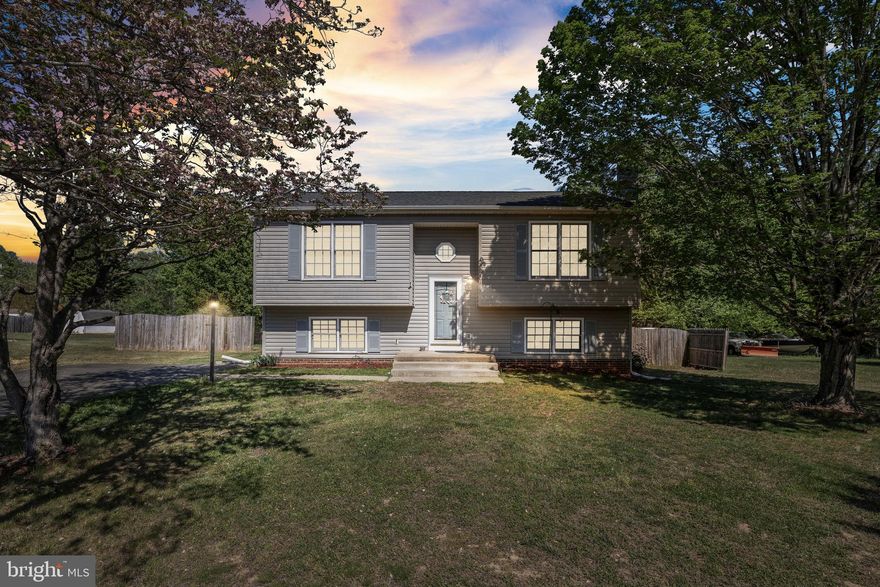 This charming split foyer home in the desirable Winewood subdivision offers a perfect blend of comfort and style. With three spacious bedrooms and two full bathrooms, the layout is designed for modern living. The heart of the home features an inviting open floor plan, highlighted by a cozy family room with a stone fireplace, perfect for gatherings. The eat-in kitchen boasts stainless steel appliances and ample dining space, making meal prep a joy. Major renovations in 2019 ensure a fresh, updated feel throughout. Enjoy the warmth of wood and luxury vinyl plank flooring, complemented by recessed lighting and tasteful window treatments. Step outside to a lovely deck and porch, ideal for relaxing or entertaining, sitting on .31 acres with a fenced backyard. Additional features include a fully finished basement, a convenient laundry area, and a shed for extra storage. With a paved driveway accommodating up to six vehicles, this home is ready to welcome you. Experience the comfort and convenience of this delightful property!