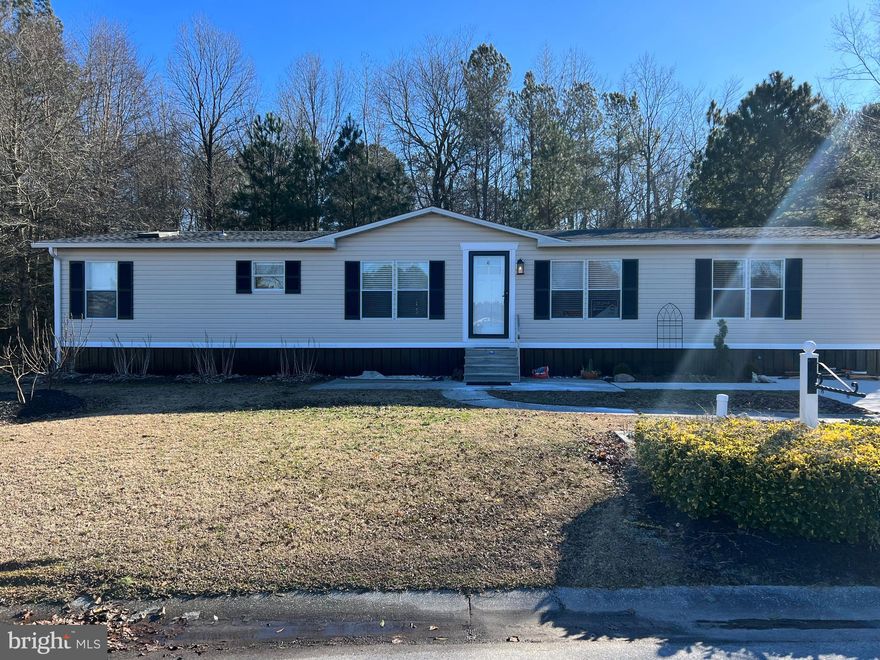 Come home and relax to an open concept floorplan and enjoy the serene view of the lake or no taxes or worries about the water bills or septic issues ever!  Recently renovated/new roof, new floors, fresh paint, countertops and kitchen cabinets,  large shed and a full size car garage. 
You're 20 minutes from Cambridge and 10 minutes from Salisbury. 
Call agent for a private showing. Has a limited home warranty for the HVAC unit.

MUST BE APPROVE BY HEBRON WOODS COMMUNITY PARK
 LOT RENT $460 PER MONTH
PLEASE CALL THE LISTING AGENT FOR MORE INFORMATION

Buyer's agent should do due diligence and confirm all information is to their satisfaction, including schools, Sq Ft and tax information. Please leave a card and provide feedback.