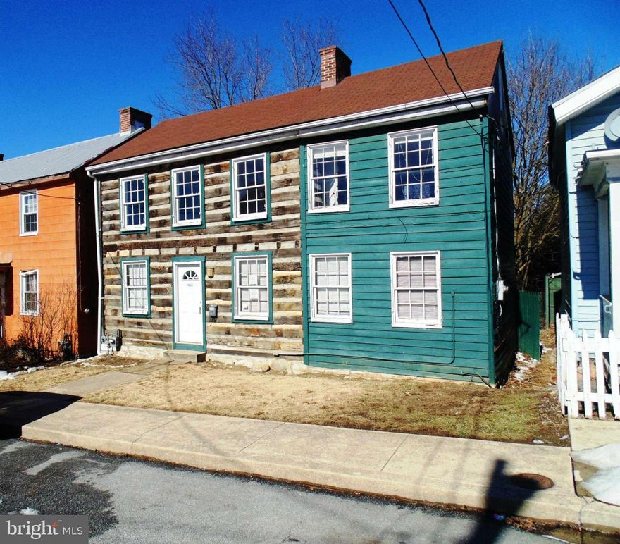 THIS PROPERTY IS ELIGIBLE UNDER THE FREDDIE MAC FIRST LOOK INITIATIVE THROUGH 03/13/2016.Incredible Log Home in downtown Martinsburg. Original hardwoods, log ceilings, fireplace, dual staircase, new appliances and new kitchen cabinets and counter top.  Deep lot with Alley access and room for outdoor entertaining.
