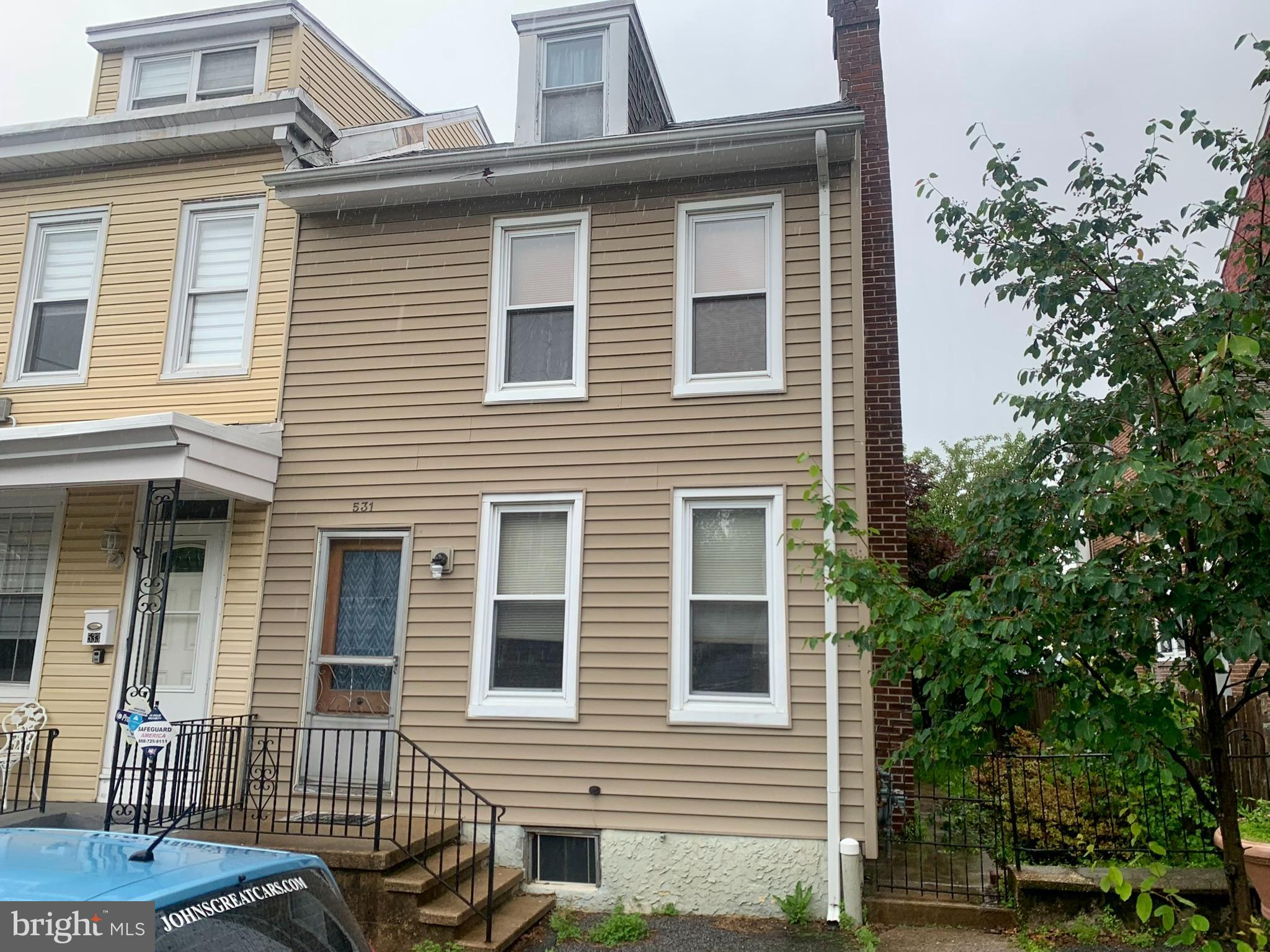 Super affordable end of row home in West Reading, Wyomissing Schools! This spacious home will wow you with all its conveniences: half a block to restaurants, shopping, schools, hospital, and plenty of off-street parking in the rear. If you like being outside, you'll love the oversized fenced yard and deck. The house features a first-floor laundry/mud room, oak kitchen that is a treat to cook in with a lot of cabinet space, spacious living room and dining room with wood floors and great bedrooms sizes. The house is very efficient with all gas hot water and new gas heater. The taxes are super low which make this house very affordable. When you go to the second floor, you'll find two generous bedrooms and a full bathroom with another room on the third floor that can be an office or craft room. This house is move in ready and waiting for its new owner.