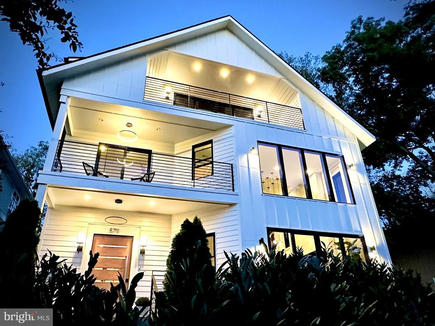 Introducing 5711 Potomac Avenue NW, a modern sanctuary in the heart of the Palisades. This meticulously crafted home (2022) spans 6,347 sq ft with 6 bedrooms and 5.5 baths, delivering sophisticated living across its thoughtful layout. This custom built home has design features that will leave you breathless, and the privacy, coupled with scenic views the city rarely affords. Anchored on a sun-drenched ridge, the home delivers sculpted blend of architectural elegance and residential tranquility. The main living level provides stunningly high ceilings, an open floor plan, a kitchen of your dreams, and a thoughtful indoor/outdoor flow. Expansive windows and expertly designed interiors allow light and views to harmonize with living spaces, cultivating a seamless connection to the outdoors. The bedrooms are generous, and the primary suite over-delivers, with an urban sanctuary design, a spa-like bathroom, huge closets, an office, and a tranquil balcony offering river views. Residents enjoy unparalleled access to the Capitol Crescent Trail and Palisades Park—ideal for active lifestyles and nature lovers. Perfectly balancing urban convenience, with nearby award-winning restaurants, tons of natural beauty and rarely available river views in both summer and winter, this exceptional home redefines modern luxury living.
