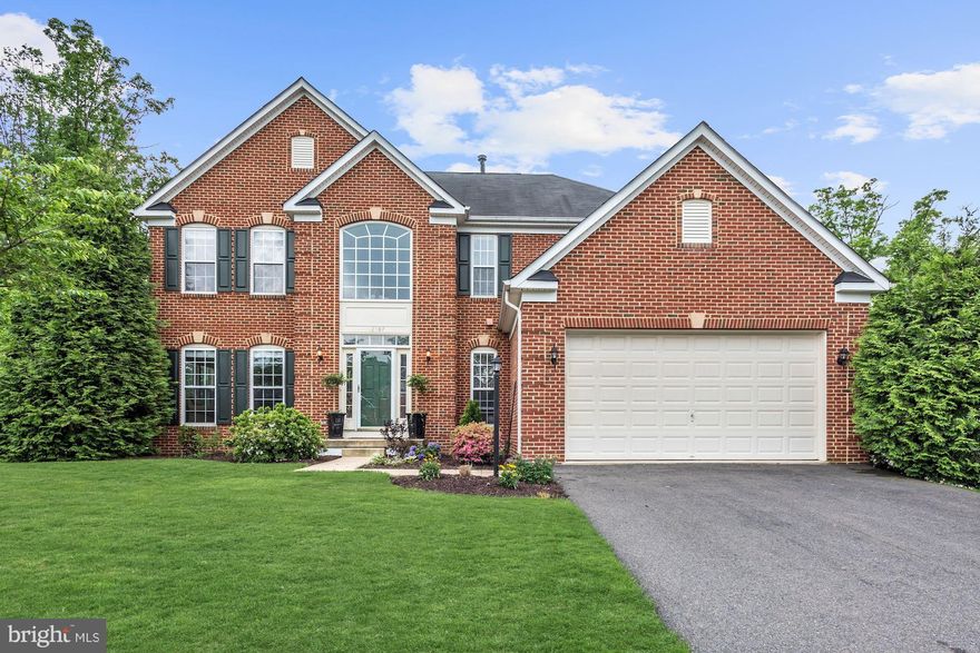 Stunning brick-front Colonial on private cul-de-sac w/scenic wooded view. Modern gourmet kitchen w/quartz counter, large island, decorator tile & SS appl. Open-concert floor plan features a spacious sunroom w/ floor-to-ceiling windows & finished LL w/full bath & 2 opt bedrooms. Add't features include custom deck, updated baths, fresh paint, CAT-5 wiring, fireplace, hardwood, arched windows & more!