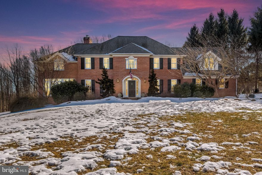 Enjoy a peaceful and private home with luxury amenities convenient to the NCR Trail, shops and restaurants. A magnificent property which sits on a quiet cul-de-sac.  The idyllic  5.65 landscaped lot includes gardens, fish ponds, waterfall and expansive brick patio. This is a spacious 4,200+ sq ft 5 bedroom, 3 full and one half bath Brick and HardiPlank Colonial. It went through a significant  renovation and expansion that included Brazilian Cherry Hardwood Floors, a Craftsman - style staircase, custom gourmet kitchen with dining area and fireplace, plus an adjacent family room with fireplace and atrium door to a covered porch.  There have also been numerous recent improvements to this gorgeous property. This is a home that offers the enjoyment of beautiful surroundings and lots of space.