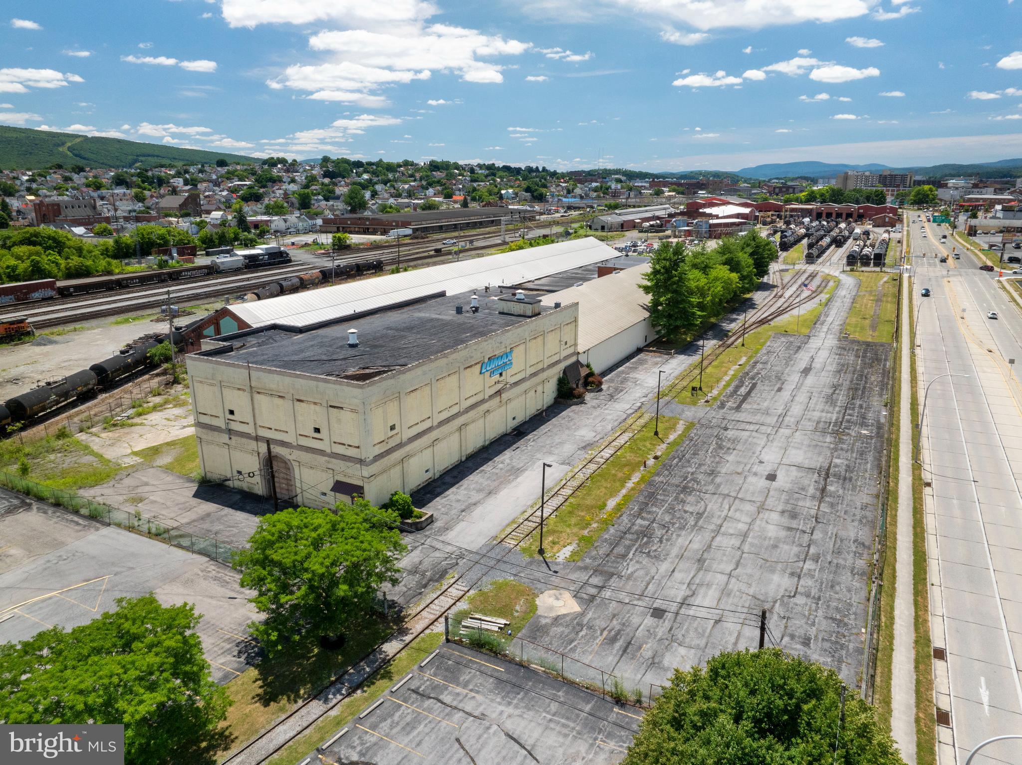 Discover the exceptional opportunity at 301 Chestnut Avenue, Altoona, PA – a massive 140,000 square foot commercial/industrial property, perfectly suited for your business needs. With its strategic location and versatile features, this property is designed to elevate your operations and maximize efficiency.
Key Features-
**Expansive Space:**
- This vast 140,000 square foot facility offers ample space for manufacturing, warehousing, or other commercial uses. The open layout ensures flexibility to customize the space to meet your specific business requirements.
**Dock Height Doors:**
- Equipped with four dock height doors, the property facilitates smooth and efficient loading and unloading operations. Whether you're handling large shipments or daily deliveries, these docks streamline your logistics.
**Railroad Access:**
- Enhance your supply chain capabilities with direct railroad access. This unique feature provides an additional transportation option, reducing costs and increasing the speed of your distribution.
**High Traffic Corridor Location:**
- Situated on a bustling high traffic corridor with over 15,000 vehicles per day on average, this property benefits from excellent visibility and accessibility. The prime location ensures easy access for employees, clients, and suppliers, making it a convenient and strategic choice for your business.
**Versatile Usage:**
- Ideal for a range of commercial and industrial applications, this property is a blank canvas ready to support your business growth. From manufacturing and distribution to storage and beyond, the possibilities are endless.
Investment Potential:
301 Chestnut Avenue is not just a property; it's an investment in your business's future. With its expansive space, strategic location, and comprehensive features, this facility is poised to support and enhance your operations for years to come. Don't miss out on this prime opportunity to elevate your business in Altoona, PA.