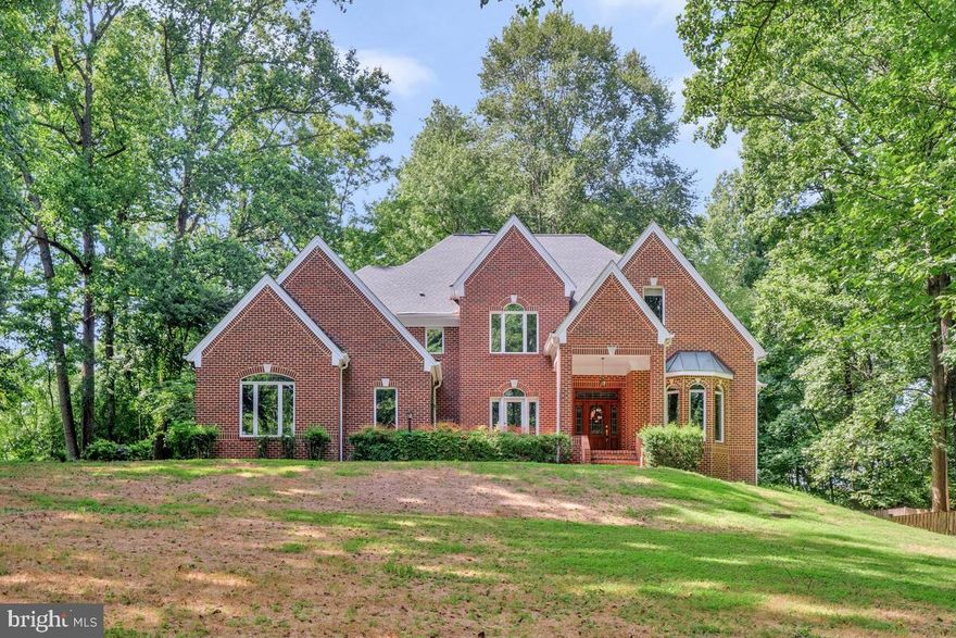 Stunning 5BR, 5.5BA home on a quiet 2-acre wooded cul-de-sac lot. This updated residence features fresh paint, wide-plank hardwood floors, and a chef’s kitchen with granite counters, center island, and stainless-steel appliances. A dual-sided fireplace connects the step-down family room and breakfast area. Main-level library with custom built-ins is perfect for remote work. The spacious primary suite offers a tray ceiling, fireplace, luxury bath, and 3 walk-in closets. Each additional upper-level bedroom includes an en-suite bath. Walk-out lower level includes 5th bedroom, full bath, large rec room, and ample storage. Enjoy the outdoors on the expansive deck or in the screened gazebo. Convenient to major routes, shops, and dining.