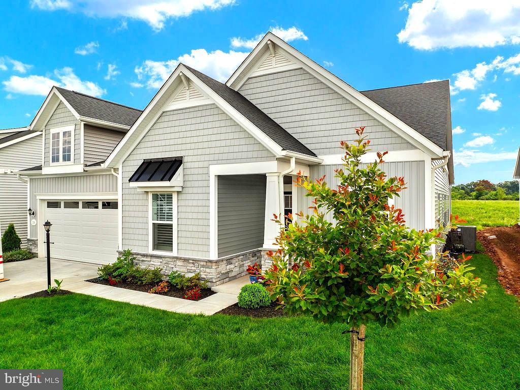 Welcome to luxury living in the sought-after Amblebrook Community! This stunning Inspire Design by DRB offers over 3,000 sq. ft. of thoughtfully designed space, including two spacious primary suites. The chef’s kitchen boasts upgraded appliances, an expanded pantry, and custom cabinetry throughout. The great room is extended and features a gas fireplace with remote—perfect for entertaining or relaxing.
Enjoy year-round comfort in the 31' x 9' four-seasons room, complete with heating, A/C, and a remote-controlled gas fireplace. Step outside under the electric awning with remote and take in the beautifully landscaped privacy area. Smart features abound, including a Nest thermostat system with sensors, doorbell, smart lock, and EERO Mesh Wi-Fi.
The 2-car garage impresses with an epoxy floor, Bluetooth remotes, and garage-rated refrigerator. One of the primary suites includes a sitting area, offering a peaceful retreat. Every detail has been elevated for comfort, technology, and style—this home is a must-see!
