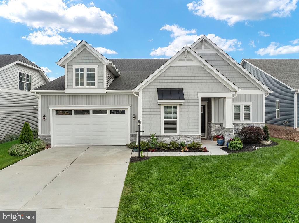 Welcome to luxury living in the sought-after Amblebrook Community! This stunning Inspire Design by DRB offers over 3,000 sq. ft. of thoughtfully designed space, including two spacious primary suites. The chef’s kitchen boasts upgraded appliances, an expanded pantry, and custom cabinetry throughout. The great room is extended and features a gas fireplace with remote—perfect for entertaining or relaxing.
Enjoy year-round comfort in the 31' x 9' four-seasons room, complete with heating, A/C, and a remote-controlled gas fireplace. Step outside under the electric awning with remote and take in the beautifully landscaped privacy area. Smart features abound, including a Nest thermostat system with sensors, doorbell, smart lock, and EERO Mesh Wi-Fi.
The 2-car garage impresses with an epoxy floor, Bluetooth remotes, and garage-rated refrigerator. One of the primary suites includes a sitting area, offering a peaceful retreat. Every detail has been elevated for comfort, technology, and style—this home is a must-see!