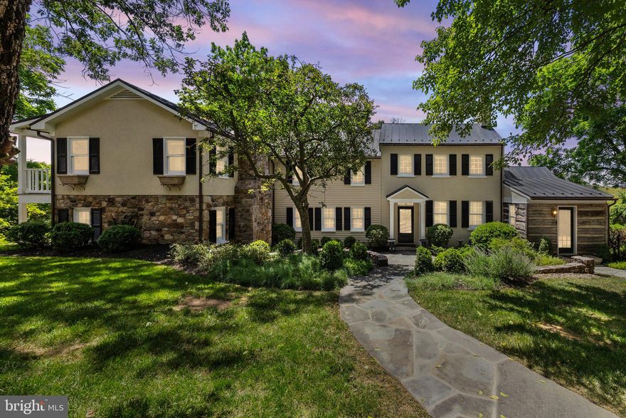 NEW PRICE!!!  Welcome to 21056 Beaverdam Bridge Rd., Middleburg, VA 20117—where historic charm meets modern luxury in a peaceful and secluded setting. Affectionately known as “Turkey Roost Farm” or simply “The Roost” by locals, this circa 1750s farmhouse offers a storybook escape nestled in the heart of Middleburg’s picturesque countryside. The interior has been thoughtfully updated to blend old-world character with today’s comforts. At the heart of the home is a gourmet chef’s kitchen featuring a Viking cooktop, soapstone counters, a custom wood island with storage, and stainless-steel appliances—perfect for both everyday living and entertaining.

This charming residence offers 4 bedrooms and 3.5 baths, including a luxurious primary suite complete with a soaking tub and spacious shower. Gather around the wood-burning fireplaces in the cozy family room and the original stone fireplace in the living room or unwind on the upper-level balcony and side yard porch. The expansive flagstone rear patio—partially covered and enhanced with skylights—invites effortless outdoor living and entertaining.

Additional features include solid hardwood flooring throughout, dual staircases, and a two-car garage with a studio loft above. A separate one-bedroom, one-bathroom cottage with an efficiency kitchen provides a perfect retreat for guests or extended family. Equestrian amenities abound with a five-stall barn equipped with automatic waterers, fenced paddocks with run-in sheds, a blue stone riding ring, and scenic trails for exploration. The property also boasts a spring house, custom chicken coop and pen, all adding to its rural charm and functionality.

Located just minutes from historic downtown Middleburg, this one-of-a-kind property offers convenient access to shopping, dining, and cultural attractions, with an easy commute to Northern Virginia, Washington, D.C., and just 25 miles from Dulles International Airport. Turkey Roost Farm is a rare opportunity to own a timeless retreat that offers both serenity and sophistication.