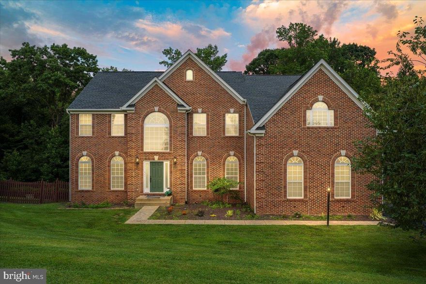Experience the best of suburban luxury in this stunning Stately Colonial Design – Classic brick-front façade with traditional architectural styling; built in 2004 Spacious Floor Plan – Over 5,300 sq ft across three levels, including a fully finished walk-out basement (1,308 sq ft) Gourmet Kitchen – Features a center island, butler’s pantry, upgraded countertops, recessed lighting, and high-end appliances including a built-in microwave and wall oven. Bedrooms & Baths – Five generous bedrooms, plus 4 full baths and a main-level half bath. The primary suite impresses with vaulted ceilings, a gas fireplace, walk-in closet, and spa-style bath. ?? Interior Features Two gas-propane fireplaces, including a double-sided mantle — perfect for open-concept warmth High-end finishes: hardwood and ceramic tile flooring, crown molding, chair rails, recessed lighting, and pristine built-ins throughout. Finished walk-out basement with daylight windows, ideal for recreation, home office, or guest suite Multiple outdoor living spaces: front porch, rear deck, and patio — ideal for entertaining or peacefully enjoying nature. 3-car attached garage plus room for 4 additional vehicles on the paved driveway — totaling 7 parking spaces . Fenced backyard with bump-outs and exterior lighting, plus an outbuilding for added storage. Easy commuting options, backing to tranquil woods for privacy but close to schools, shopping, and major routes.