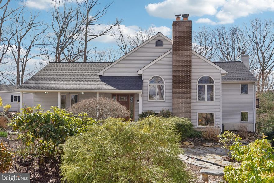 Welcome to 1055 Marriottsville Rd, a beautifully maintained single-family home set on 3.83 scenic acres in sought-after Marriottsville, Maryland. Lovingly cared for by the same owners for 38 years, this property offers a rare combination of space, thoughtful updates, and a peaceful natural setting.

The main level features a spacious living room and a gourmet kitchen with ample room for cooking and gathering, flowing seamlessly into the dining area. The primary suite includes a private bath with ensuite features and a cozy propane fireplace, creating a relaxing retreat. An additional bedroom and a full hall bath complete the main level. Hardwood oak flooring enhances the living room and bedrooms.

The finished lower level offers exceptional flexibility with a large family room ideal as a recreation space, home office, or media room. Two additional bedrooms, a full bath, and a dedicated laundry room provide comfortable accommodations for guests or extended living.

This home has been thoughtfully expanded and updated over the years, including a dining room/workshop addition (1994) and bedroom addition (2000). Major improvements include conversion to propane heating and cooling with a 1,000-gallon owned tank (2016), roof replacement with 30-year architectural shingles (2019), upgraded lower-level living spaces, and replacement of all sliding glass doors and the front entry door (2026). Two wood-burning stoves add charm and supplemental warmth.

Outdoor features include a 14' x 24' detached garage and a 10' x 16' shed (both added in 2014), along with open and wooded areas offering privacy and versatility. The property extends into a scenic wooded area and a natural ravine, while a maintained field with a 65-ft easement offers potential for fencing or pasture use.

Enjoy tranquil surroundings with preserved farmland and newly planted fruit orchards to the east, and wooded views extending toward Patapsco State Park to the west. Conveniently located yet privately set, this property offers a unique opportunity to enjoy rural charm with modern comforts.

Schedule your private tour today and experience all this exceptional property has to offer.