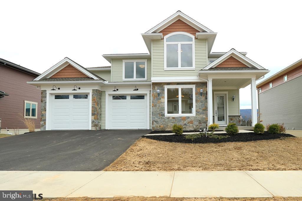 New construction with a floor plan unlike any other. Spanning nearly the entire length of the home, a curved wall offers unparalleled views of Tussey Mountain and 40 acres of open space. At over 3,600 s.f., this 5 bed/3.5 bath home on a walk-out lot features oversized windows for unbelievable natural light, a kitchen that will impress the most ambitious home chef, and high-end curated details and finishes that are sure to please. 1st floor features a mud room, office, and great deck for entertaining. 2nd floor is completed by 4 bedrooms, including the master and en-suite, a hallway bathroom, and laundry room. Open, bright walk-out LL apartment perfect for extended guests, and also features a rec room. Buyer may still have selection choices.  Estimated DOC is March 2019. Lead agent is related to builder and owners of Rockey Ridge Partnership and is a licensed real estate salesperson.