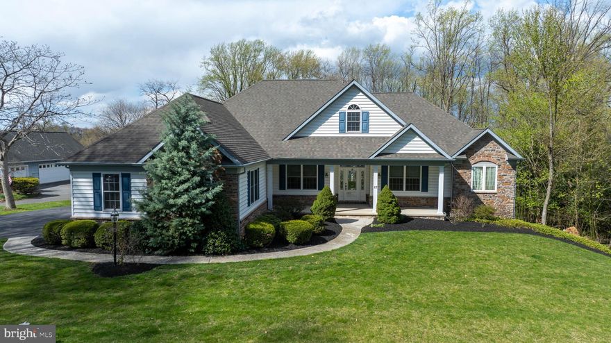 Well maintained one owner stone and vinyl ranch  style home with walk out finished lower level. This  charming one floor living home offers 4 bedrooms with the main bedroom features including  Walk-in lighted closets, his and her wash bowls, a whirlpool tub with separate seated private shower stall, with multiple shower heads. The 3 other bedrooms are more than adequate featuring, 3 paneled solid wood doors, double door closets and wall to wall carpet.  A second full bath, and powder room with pedestal sink. Full size washer and dryer in the laundry room with storage cabinets and pocket door. There is access from the laundry room to the attached garages and also steps to an upper storage room above the laundry.
Oak flooring throughout,  Central Vac., cathedral ceiling and stone gas fireplace in the LR with raised hearth, mantle and pass through window with shutters from the kitchen into the living room for easy serving. Formal DR with tray ceiling and oak floors. Tons of storage in the kitchen, with pull out racks, Lazy Susan, deep drawers, garbage disposal, water filter system, built in wine and glass rack.  SS appliances, with double door refrigerator, built in microwave and oven, plus glass top counter range.  Dual SS sink, corner garage for appliance storage, ceramic tile back splash, pantry closet, Breakfast nook, has tons of light coming into the home with the atrium windows above doors. Large wrap around deck with retractable awning can be accessed from the Breakfast nook, Living room or Main bedroom.
Large LL family room offers great space for entertaining, office, storage or put in another bathroom, you choose. In addition are several bonus rooms and an oversized garage. The garage is presently used for storing the riding mower and other equipment. Rear private patio, a fish pond with landscaping and a relaxing view.  Ample parking and storage with 7 garages including a lift in one bay and separate storage shed.  All of this and much much more.