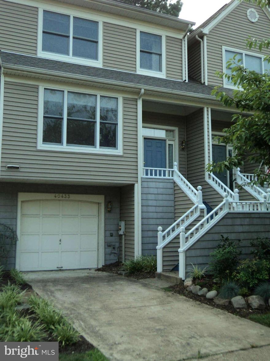 Gorgeous 4 level townhome w/ absolutely beautiful year-round views of Cherry Cove. Spacious kitchen & hardwood floors from top to bottom! Enjoy cookouts on the deck or relax on screened porch. High efficiency AC 2012, nicely kept w/ lovely landscaped entrance & new gutters. Golf course, pool & tennis courts available w/ membership. Walking distance to comm beach & pier ($50 yr) Occupy immediately.