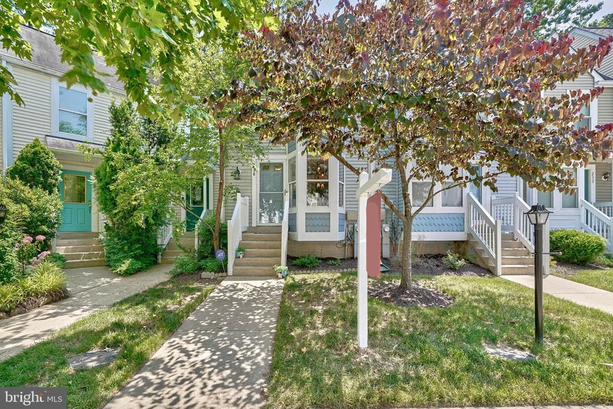 **Seller requests all offers to be submitted Monday 6/24  by 7 pm**  Stunningly updated 3BR, 2.5BA three-level townhouse in the desirable Russett community! The main floor features a powder room, a formal dining area, a cozy living room with a gas fireplace, and ample storage closets. Upstairs, two generously sized bedrooms offer vaulted ceilings, abundant closet space, and a renovated spa-like bathroom with skylight,  a soaking tub and separate shower. The charming eat-in kitchen is flooded with natural light from a box-bay window and includes plenty of cabinet space, stainless steel appliances, a large under-mount stainless sink and new fridge (2023), The lower level provides a spacious utility/storage area with a washer and dryer, a third bedroom, and a second full bathroom. Enjoy peaceful evenings on the quiet deck off the living room with a lovely wooded view, or relax in front of your gas fireplace.  New Carpet just installed! The Russett community offers amenities such as pools, tennis and basketball courts, walking trails, a clubhouse, and more! Ample overflow parking is available. Conveniently located near shopping and entertainment, just minutes to Fort Meade, and centrally located between DC, Baltimore, Arundel Mills, and Annapolis, with easy access to major commuter routes.