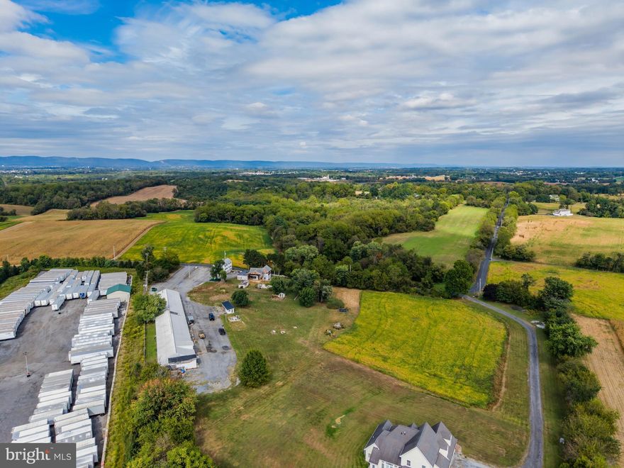 Unique property situated on 5.54 acres just outside of Carlisle! The property includes the shell for a 3,652 SF 4 bedroom, 3 full bath, and 2 half bath primary residence, a second 2,000 SF residence or rental home. There are multiple outbuildings on this site, including a 12,000 SF +/- shop/garage and a chicken coop.  Bring your ideas and make this one your own!