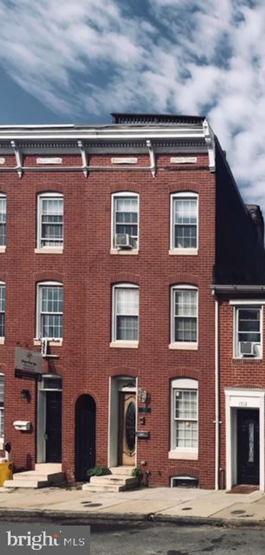 This beautifully renovated 4BDs, 2 Full Baths in the Heart of Federal Hill is an awesome place to call home! Shining hardwoods & exposed brick throughout.  Completely renovated includes kitchen with stainless steel appliances opens to private back deck. 2 BEDs, upper level with full bath, double sink & Whirlpool tub.  Third level opens to master bedroom suite also w/double sink &  Whirlpool tub & walk-in closet. Roof deck with 360 spectacular views of downtown!  Don't miss this one!