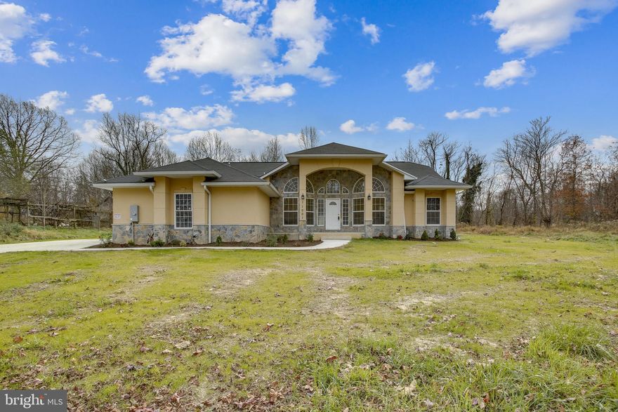 HUGE PRICE IMPROVEMENT! Fabulous, expansive custom built in 2020 with contemporary architectural details and elegantly sited on a 1.51- acre lot backing to a picturesque, tree-lined conservation area. Flooded with natural light through large arched picture windows, this sensational 6 BR, 3 Full BA and 1 half BA home boasts over 4,000 sq. ft. of total finished space, main level Owner's suite with luxurious full bath with privately backyard view, 2 story vaulted ceiling doorways with expansive hall entry, and multi-functional flowing floor plan. A modern gourmet island kitchen, dining room with vaulted ceiling, inviting and spacious 2-story living room with electric fireplace showcase the stylish main level, and creates the open flow family gathering area, gleaming hardwood floor with off the kitchen breakfast room, it leads you to step outside enjoying the vast backyard and greenery. Three additional main level bedrooms with full bathroom and half bath give you the full flexibilities to create the home space the way you want. The bright walk-up lower level is the perfect in-law or au-pair suite with lot of sunlight, recreation room, fifth & sixth bedroom with the full bath, plenty of open spaces awaits your imagination to make it your very own space. The outdoor patio provides for great entertaining space and feature serene views of the sprawling. Take the advantage of the great and unique amenities without the HOA fee, as the property owners can enjoy the easy access to RT 4 & I495, nearby restaurants and stores. Easy 2.5-5 miles to the Rosaryville state park & Lake residential golf course, within 15 mins to washington D.C., this one-of-a-kind home will wow the most discerning buyers! Don't miss this chance, schedule your showing now!