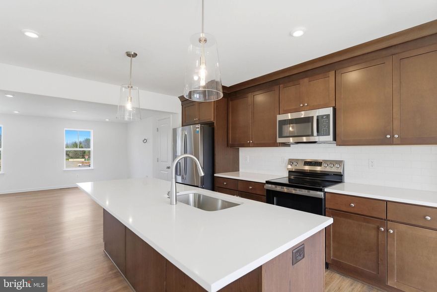 **UP TO $10,000 CLOSING COST ASSISTANCE FOR PRIMARY RESIDENCE WITH USE OF APPROVED LENDER AND TITLE!**
QUICK MOVE-IN OPPORTUNITY – ONE OF THE FEW REMAINING! This beautifully finished 1,950 sq ft townhome is move-in ready and available now in the newest phase of Boyd's Crossing! Designed for both comfort and convenience, this spacious home features modern finishes, open-concept living, and low-maintenance living with HOA services that include front yard landscaping and trash pickup. Residents also enjoy some of the largest townhome homesites in the area, offering added space and value. As one of the first opportunities in this growing new community, buyers also have the potential to build equity early as the neighborhood continues to develop and expand. Don’t miss your chance to own one of the few remaining homes currently available in this first section of the sought-after South Berkeley community. Perfectly located near the Virginia state line, Boyd's Crossing offers commuters convenient access to Interstate 81 and an easy drive to Northern Virginia. Enjoy being just minutes from shopping, dining, community parks, and local recreation centers, making it easy to stay connected to everything you need while still enjoying the comfort of a peaceful neighborhood setting. Schedule your tour today—this completed quick move-in home won’t last long!