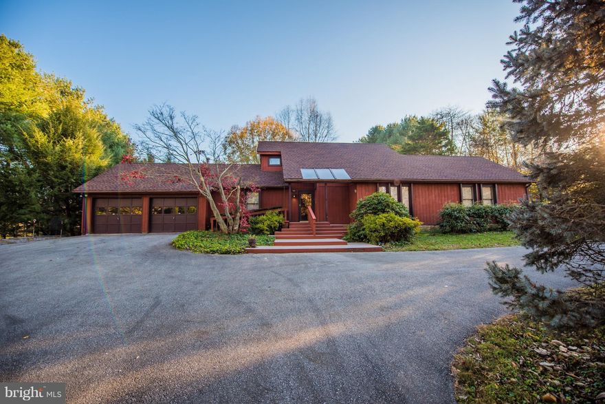 A Great contemporary home, circa 1980 with only 2 owners. Private and wooded lot. Secluded driveway, greenhouse attached, 2 car garage, most maint free flooring, great outbldg/workshop with electric, decking, ramp, live on one level, guest quarters on upper. Well cared for home. Many retro features and vaulted ceilings. Several skylights throughout