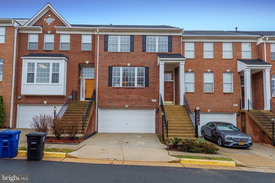 Brick front 2 car garage townhome in a desirable location.  This three finished level townhome features 3 bedrooms and 3.5 baths.  Hardwood foyer entry with stairs to the carpeted  living room with crown molding. The dining room has hardwood floors, chair rail and crown molding.  The kitchen has stainless appliances, a pantry and a large center island opening onto the family room with a gas fireplace.  The sliding glass door leads to the Trex deck.  Upstairs the primary suite has a large walk in closet, tray ceiling and luxurious bath with separate tub and shower and skylight.  Two secondary rooms with vaulted ceilings, a hall bath, upper level laundry and a skylight complete this level.  The lower level has a large rec room and full bath leading out to a fenced rear yard and paver patio.  two car garage with extra storage. Walk to pool, shopping, schools.  Close to commuter routes.