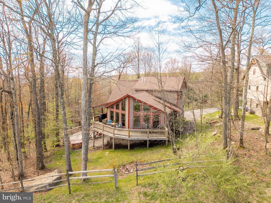 Experience mountain living at its finest in this stunning 5-bedroom, 6-bath retreat nestled directly on the slopes of Wisp Resort with breathtaking views of Deep Creek Lake. Designed for those who love skiing, nature, and luxury mountain escapes, this exceptional home offers over 4,000 square feet of beautifully designed living space.  
The open-concept layout is filled with natural light, creating a warm and inviting atmosphere perfect for gathering with family and friends after a day on the slopes. Enjoy peaceful mornings and unforgettable sunsets from two expansive levels of decks surrounded by the beauty of Garrett County.
With plenty of room to spread out, this home is ideal as a second home, a vacation property or your full time home. Conveniently located just minutes from Deep Creek Lake, Lodestone Golf Course, local dining, hiking trails, and year-round outdoor recreation, this property offers the ultimate four-season mountain lifestyle.