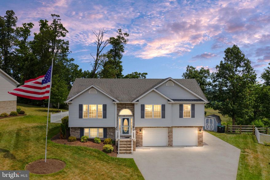 Welcome home to this spacious 4 bedroom (possible 5th bedroom with bonus area), 3 full bathroom split foyer in Madison Heights in Strasburg!  Freshly painted!  Amazing views from your deck and rear windows of the valley!  NEST thermostat!  New laminate flooring!  Central VAC!  The main level has an open floor plan with a living room, dining room with bay window and access to the deck, and a kitchen with granite countertops, recessed lighting, an island with wainscoting, stainless steel appliances less than 2 years old, backsplash, and pantry.  This whole area has beautiful laminate floors throughout and vaulted ceilings.  Walking down the hallway leads you to a full bathroom with ceramic tile flooring and into three bedrooms with brand new laminate flooring.  The primary bedroom has a walk-in closet with built-ins and the primary bathroom has a double vanity, standup shower, jacuzzi tub and recessed lighting.  Walking downstairs, you will find another bedroom with built-in bookshelves and a bonus room (possible 5th bedroom) all with laminate flooring and another full bathroom.  The laundry room is downstairs as well with a washer and dryer and laundry sink.  You can access the 2-car garage from this level, and there is also a fenced in backyard (white vinyl) and storage shed.  Call me today to see this one!